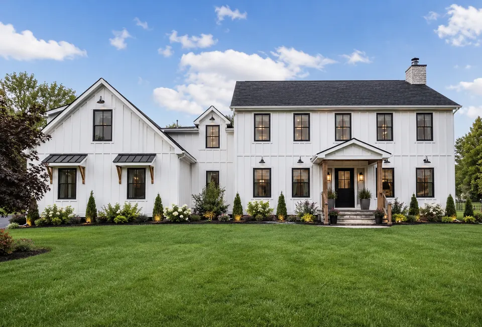 White farmhouse with black trim, a Hudson Valley residential home